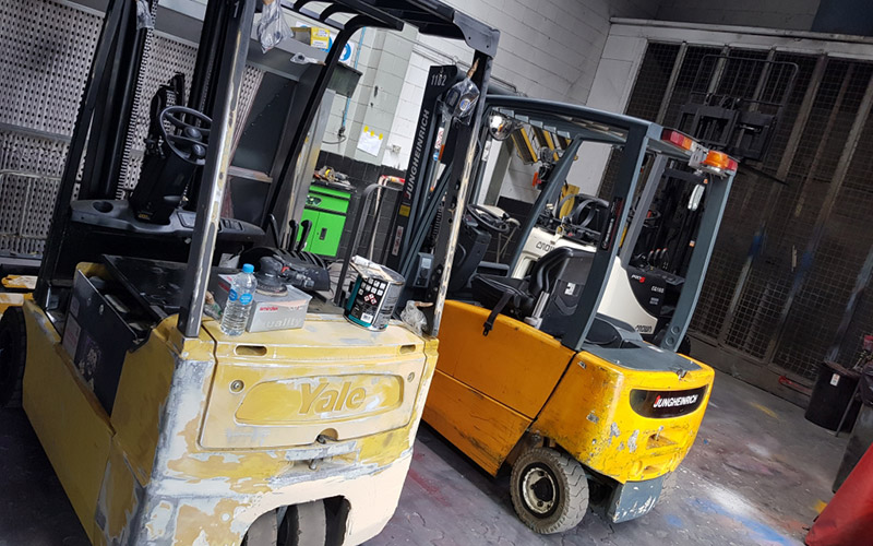 Image showing two forklifts ready to be refurbished at the Grace Industrial factory in East Tamaki.