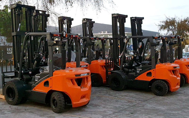 Image showing a group of orange and black forklifts parked outside the Grace Industrial premises in East Tamaki.